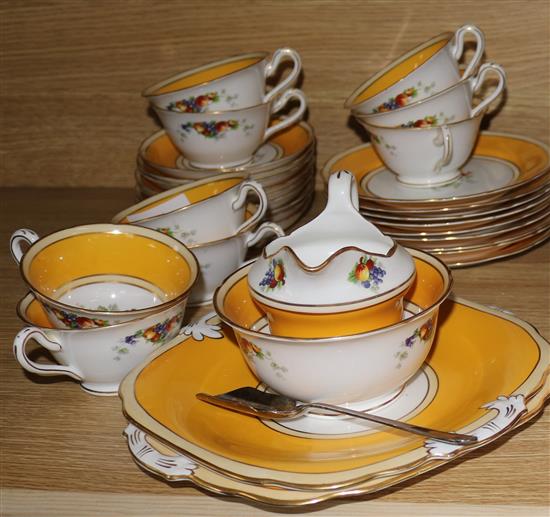 A gilt and yellow banded fruit design Ye Old English tea set.